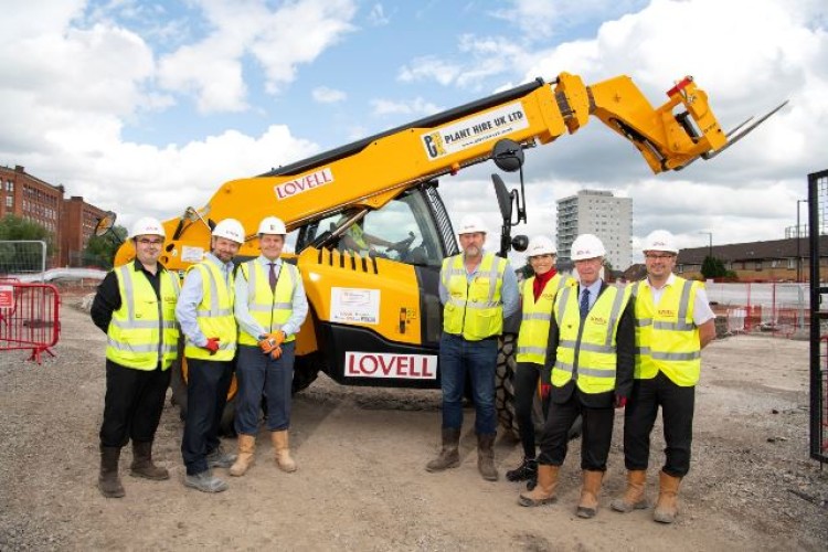Left to right are Daren Asson, Rob Worboys, Graham Jones, Shaun Cornthwaite, Patricia Gorecka, Paul McGarry and Ian Lord. They are all from Lovell except for Graham Jones, who is MD of Plant Hire UK.