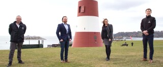 Willmott Dixon’s Plymouth-based team on Plymouth Hoe. From left to right: Steve Bromley, Rob Woolcock, Shirley Halford and James Robins