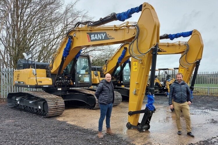 Paul Cogger of MC Plant, left, with Leigh Harris, dealer development director for Sany UK, with the first machines to arrive at MC Plant&rsquo;s headquarters in Larkfield