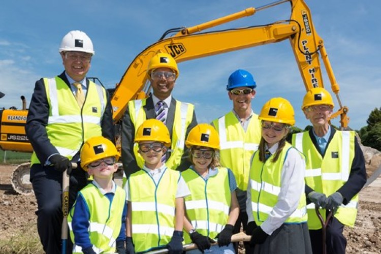 Current pupils mark the official start on site of the new Pimperne Primary School. They are joined by Len Vincent (far right) one of the school&rsquo;s oldest former pupils 