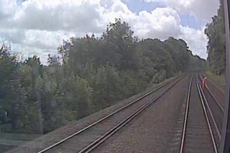 Train CCTV image shows worker on the track (courtesy of South West Trains)