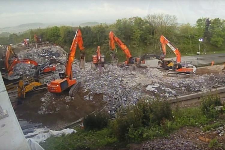 A fleet of 17 excavators was used to clear away the demolition rubble