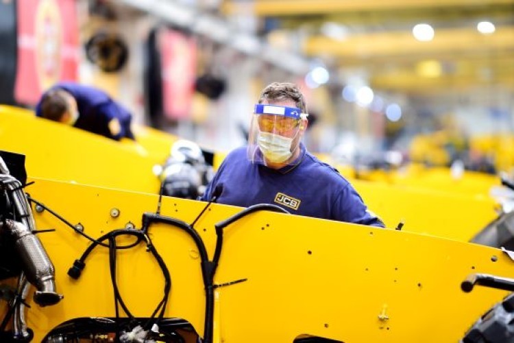 A JCB worker taking the precautions of the moment