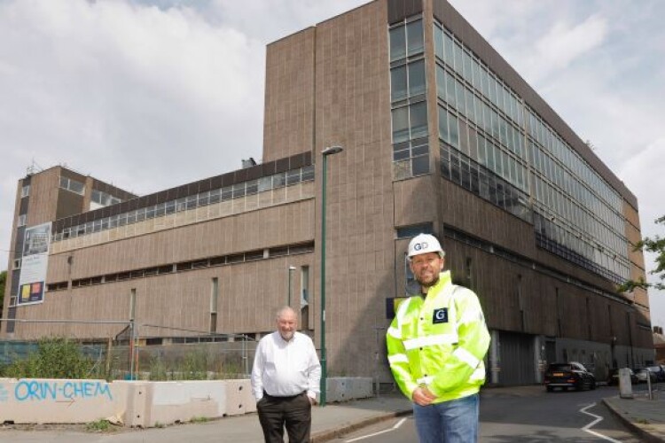 Godwin director Stephen Pratt with Ken Grundy of Emma Property Management in front of the building