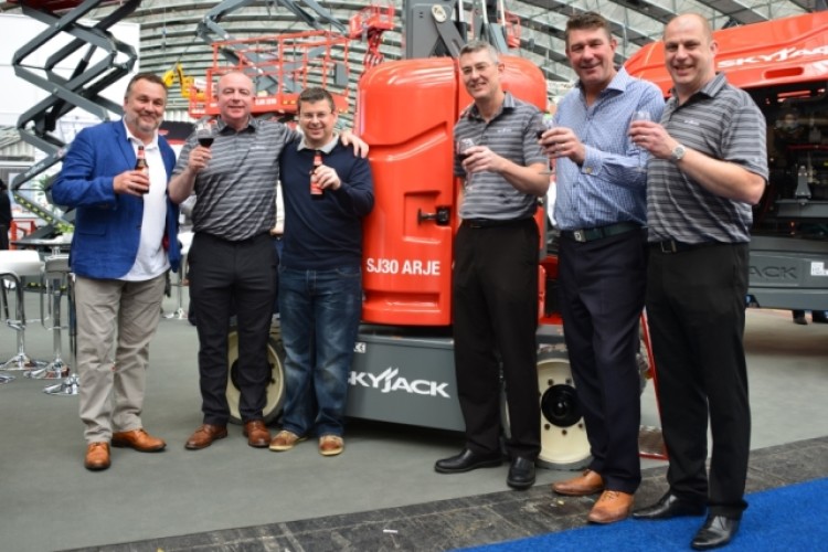 Toasting the Skyjack deal are, from left, Bryan Freeman (Star Platforms), Charlie Patterson (Skyjack), Steve Simmons (Star Platforms), Brad Boehler (Skyjack), Richard Miller (Star Platforms) and Dean Marks (Skyjack).