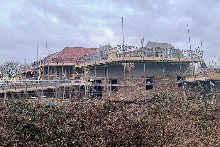 Cloudy skies over house-building