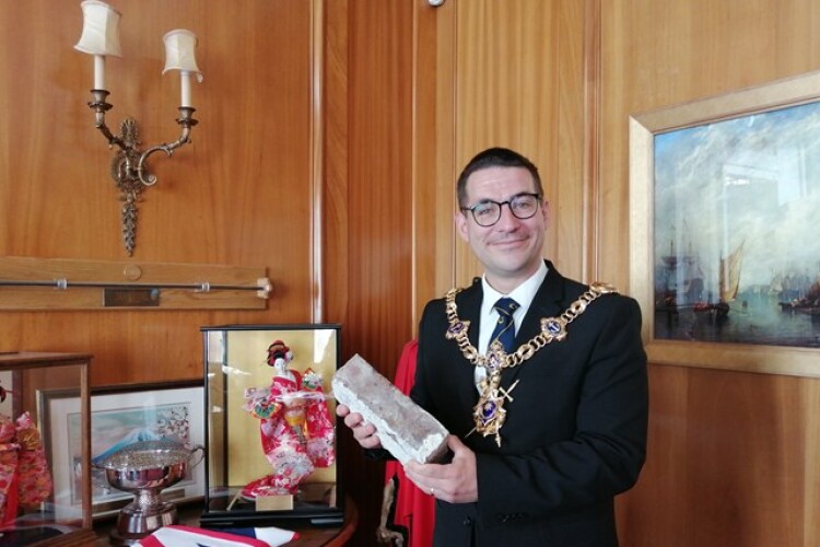 Cllr Coles displays his brick