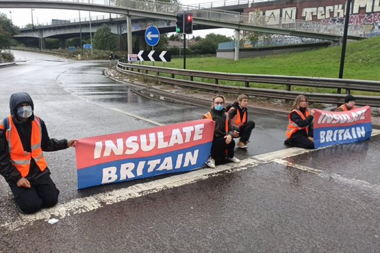 Governemnt is taking action after several instances of Insulate Britain protesters blocking traffic. [Image from Insulate Britain's Twitter feed]] 