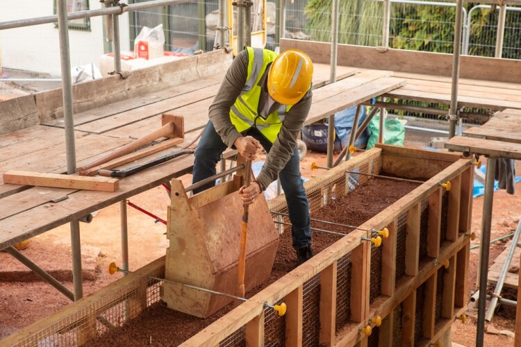 A cob wall goes up