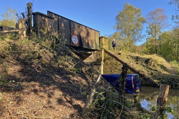 The bridge in Toller Porcorum that National Highways wants to pull down, and the flooding it caused beneath. (©Michael Hancock)
