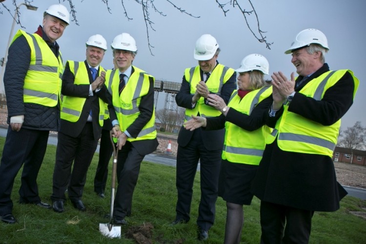 Defence minister Dr Andrew Murrison cuts the first turf