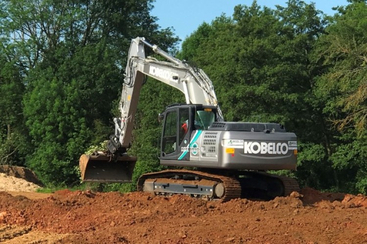 The Kobelco SK210HLC-10 