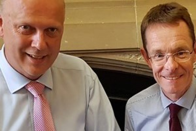 West Midlands mayor Andy Street hands over the business case to Chris Grayling