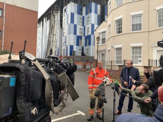 Assistant county fire officer Dave Keelan speaks to the press at the scene in Bolton