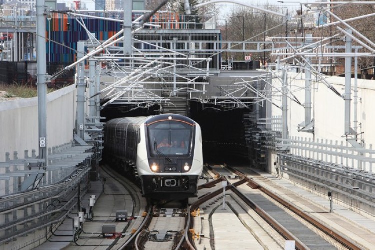 Elizabeth line test train exiting Victoria Dock portal