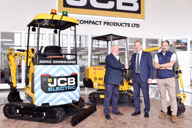 Arnold Plant Hire founder Robin Arnold (left), Robert Winter, managing director of JCB Compact Products and Arnold Plant MD Philip Oldham with the new JCB19C-1E and the original JCB 801 that it bought 30 years ago
