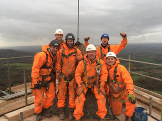 The Apex team celebrates completion of the scaffolding 