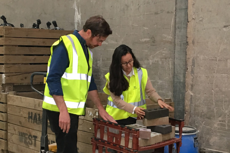 Prof Gabriela Medero and her colleague Dr Sam Chapman examine samples of the new K-Briq