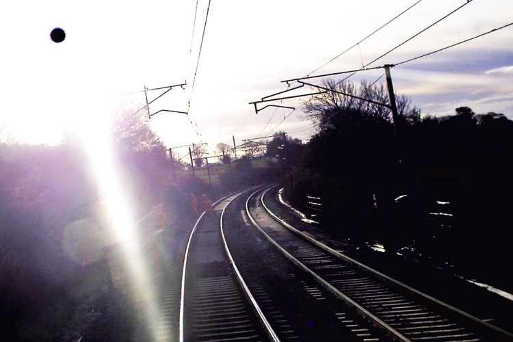 Forward-facing CCTV image from front of train approximately one second before it passed the inspection team (Virgin Trains). The image was affected by bright sunlight and was enhanced by RAIB to improve its clarity.