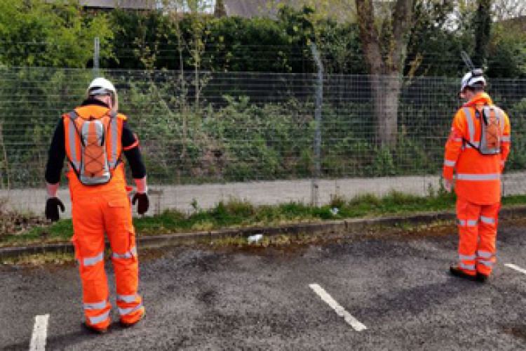 Interserve workers wearing personnel distancing system backpacks