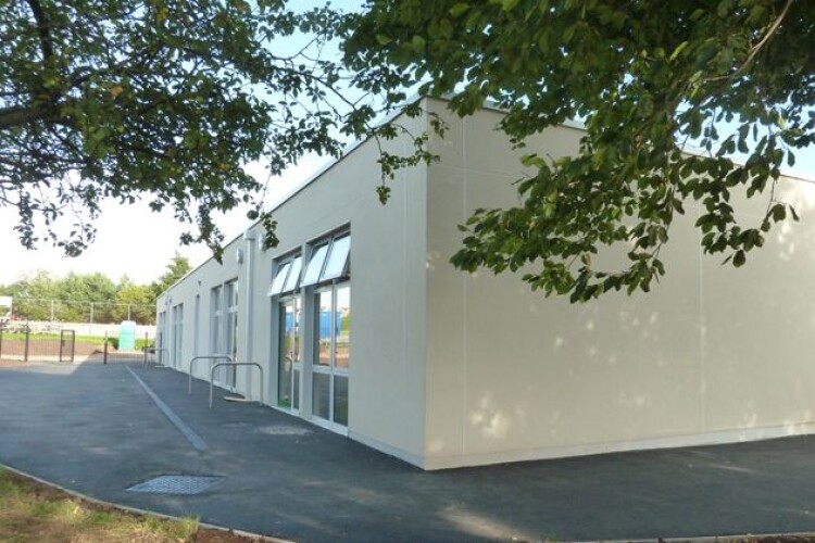 Skanska has trialled flying factories on a school building in Bristol using straw and timber construction