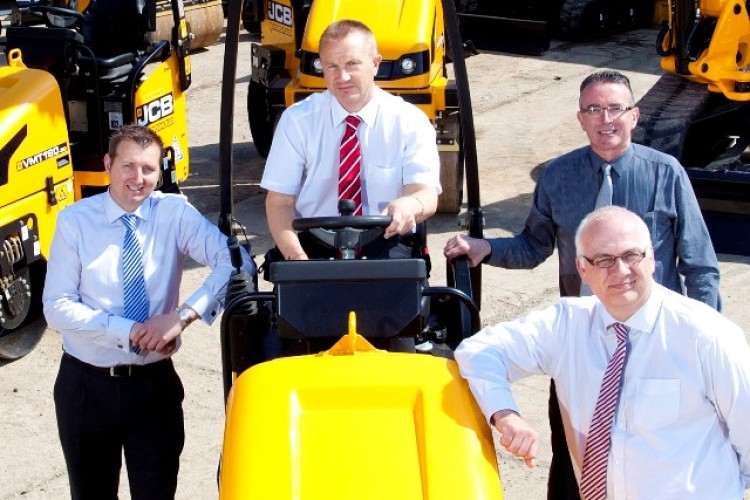 TC Harrison JCB sales executive James Taylor, Mechplant joint md Stephen Makinson (left), TC Harrison general sales manager Steve Prescott and TC Harrison JCB joint md Robert Wilson (front right)