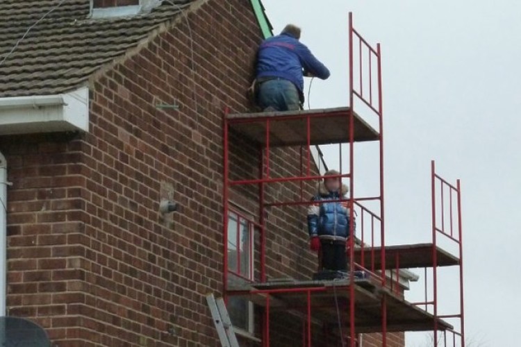 10-year-old lad with his dad at work