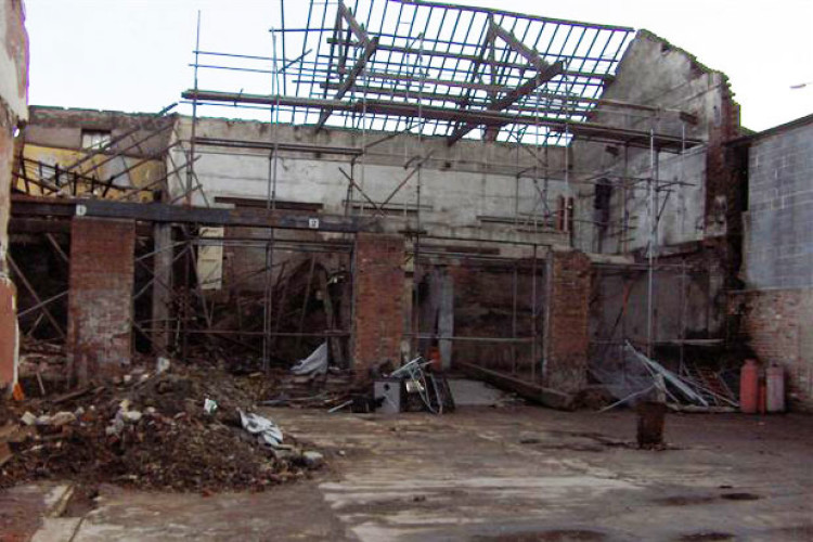 The building after the gable end collapsed, with the roof structure missing from the left hand side