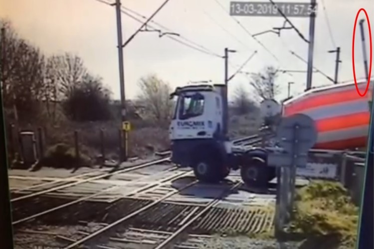 CCTV view of the stationary lorry and partly lowered level crossing barrier (highlighted) courtesy of Network Rail 