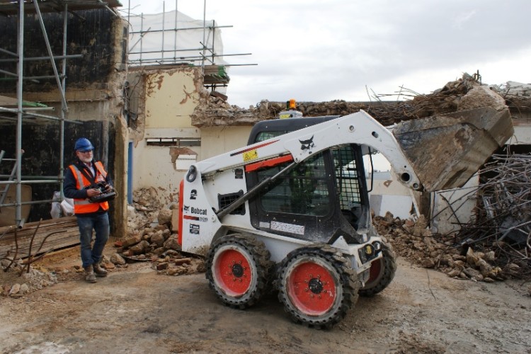 Remote controlled Bobcat S450 at work