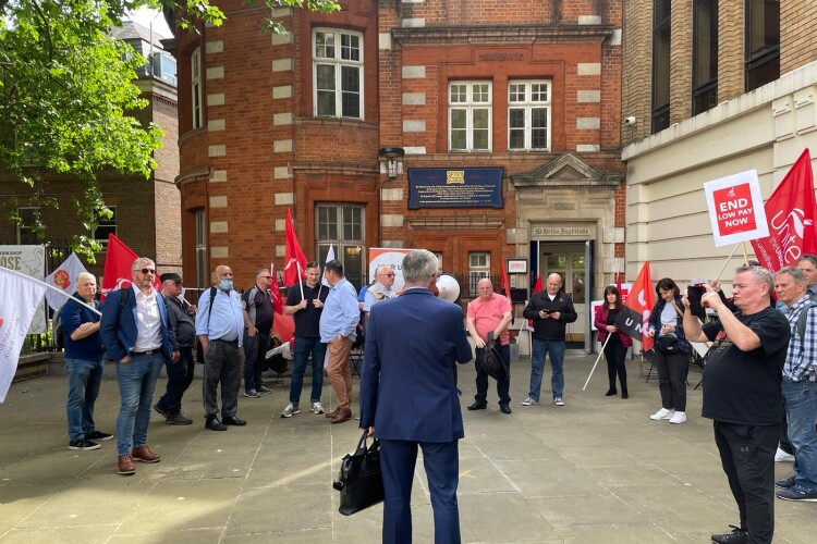 Construction workers protesting outside the CIJC meeting in London 