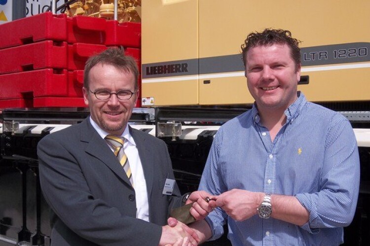 Iain McGilvray (right) takes the keys for the LTR 1220 from Liebherr product manager Klaus Huberle