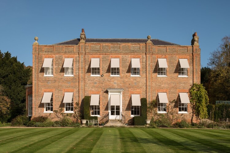 Rooms on the southwest elevation of this grade II* house increasingly suffered from overheating in summer. Historic fixings for external blinds were identified in the window reveals and replacement blinds were fitted. [Credit: Historic England]