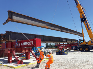 The Bar Hill junction bridges were assembled on trestles alongside the A14 and carried into position by heavy-lift specialised Mammoet.