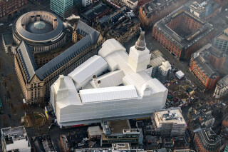 Manchester Town Hall is now completely covered with shrink-wrapped scaffolding and temporary roof systems