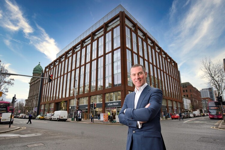 Ray Hutchinson, managing director of Gilbert-Ash, stands in front of Merchant Square