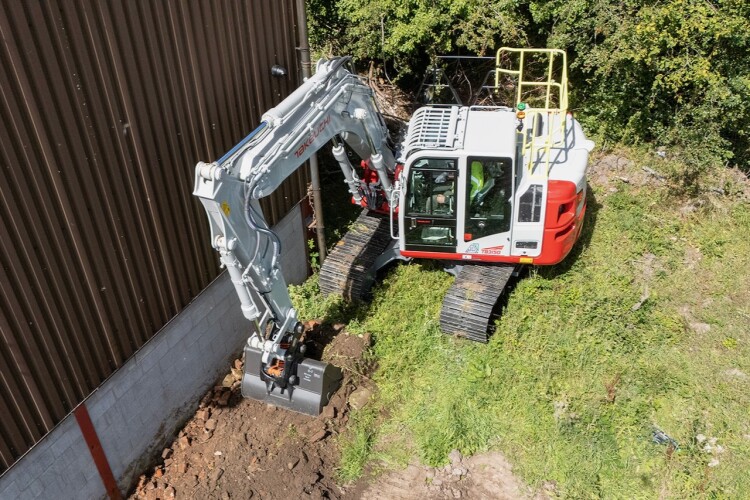 Takeuchi's offset boom allows for working in constricted conditions