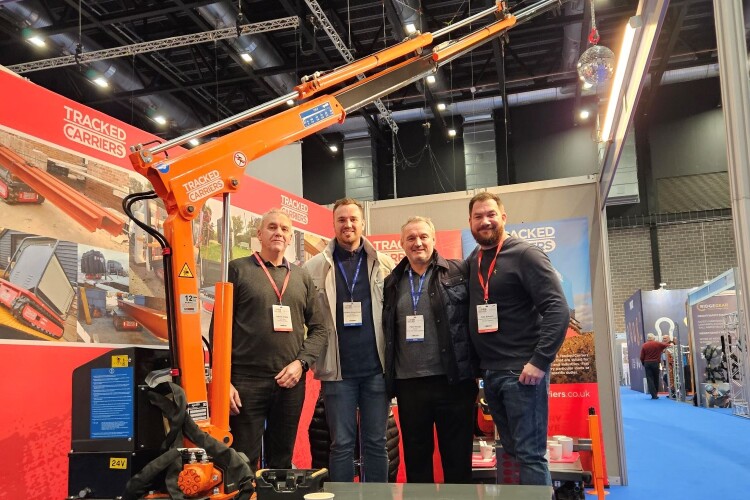Anatree Logistics takes delivery of its bespoke 2200 Pro. From left: Darren Potts of Tracked Carriers, Christian Elwiss-Hough and Peter Hough of Anatree Group Logistics, and Ben Dobson of Tracked Carriers. 