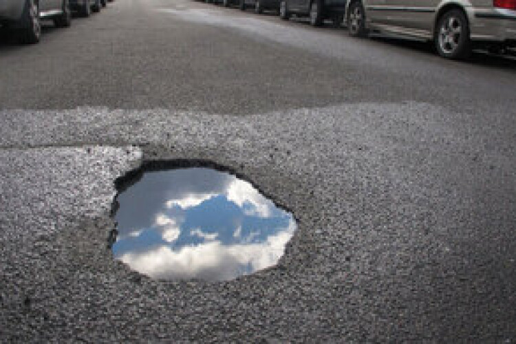 A pothole in Streatham, south London. Thanks to the cancellation of HS2, it can now be filled.