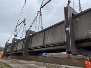 The bridge was lifted intact and laid down away from the railway line for subsequent demolition