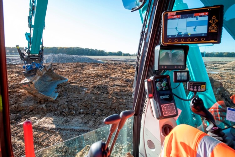 The Kobelco excavator is rigged with Leica's MC1 GPS machine control platform