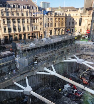 The crane, mounted on a gantry, kept the basement excavation fed with materials