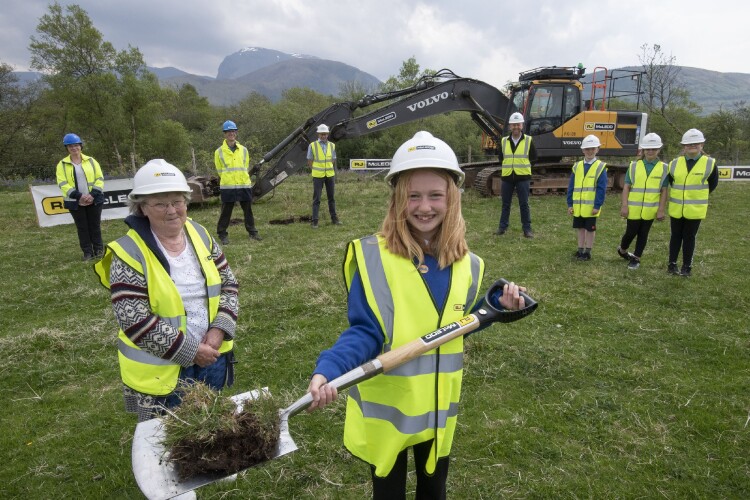 Caol Primary School pupil Isla Ross and Joan Ling of Caol Community Council helped dig the first turf (photo by Iain Ferguson, The Write Image)