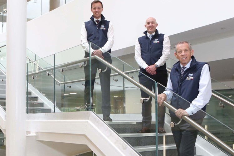 Construction manager Richard Wynne (left), quantity surveyor David Wynne (centre) and managing director Chris Wynne of Wynne Construction at the Coleg Cambria Yale site that was built by their family business