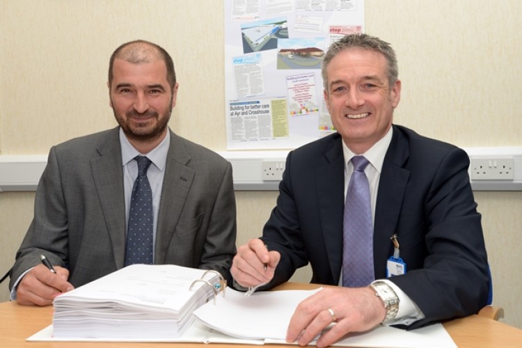 BAM director Doug Keillor and NHS Ayrshire & Arran chief executive John Burns put pen to paper
