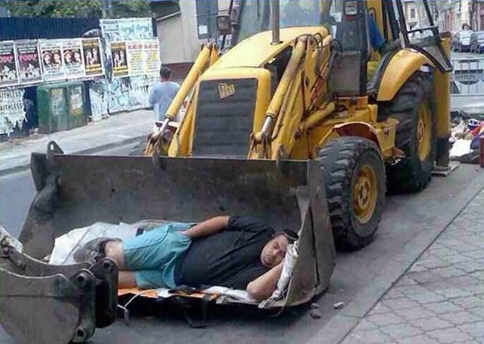 JCB loader bucket doubles up as bed JCB loader bucket doubles up as bed