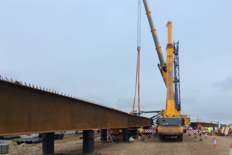  In this photo of site preparations, supplied by Highways England, the branding of the crane owner has been blurred for some reason. Presumably someone doesn&rsquo;t want us to know that it is Ainscough.