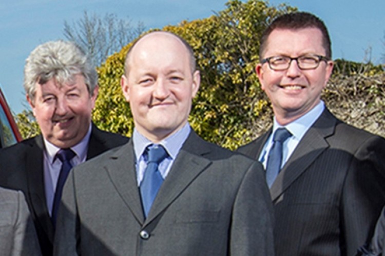 New owners of A&N Lewis, left to right, are Garry White, Andy Gooch and Andrew Gentile