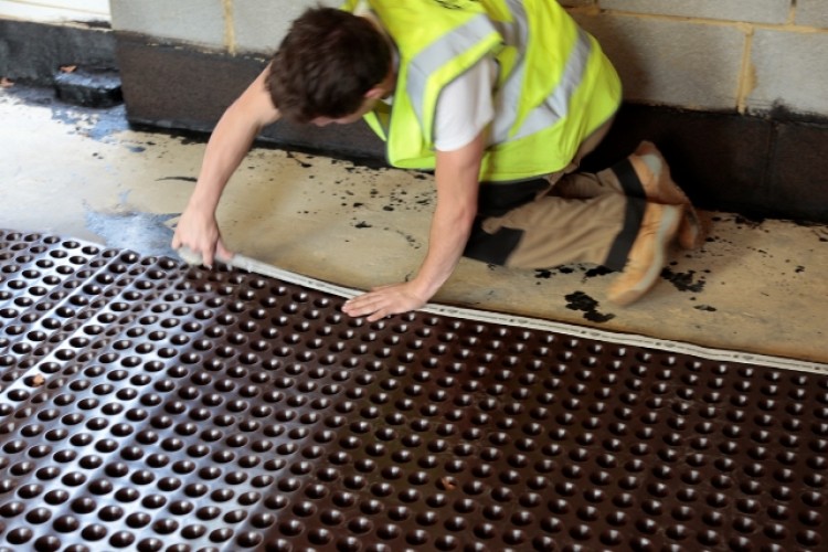 Floor membranes channel water towards drains