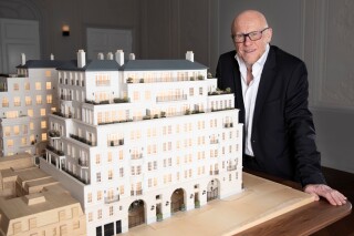 John Caudwell with the architectural model [image credit: Caudwell/David Woolfall]